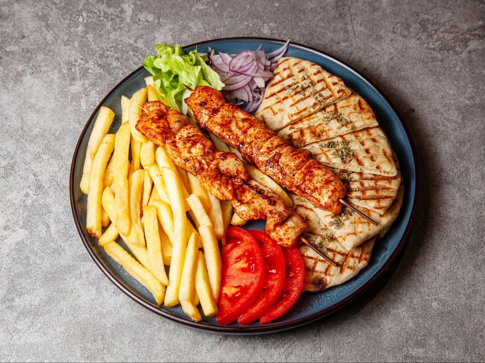 Gyro platter with grilled chicken pita and fries