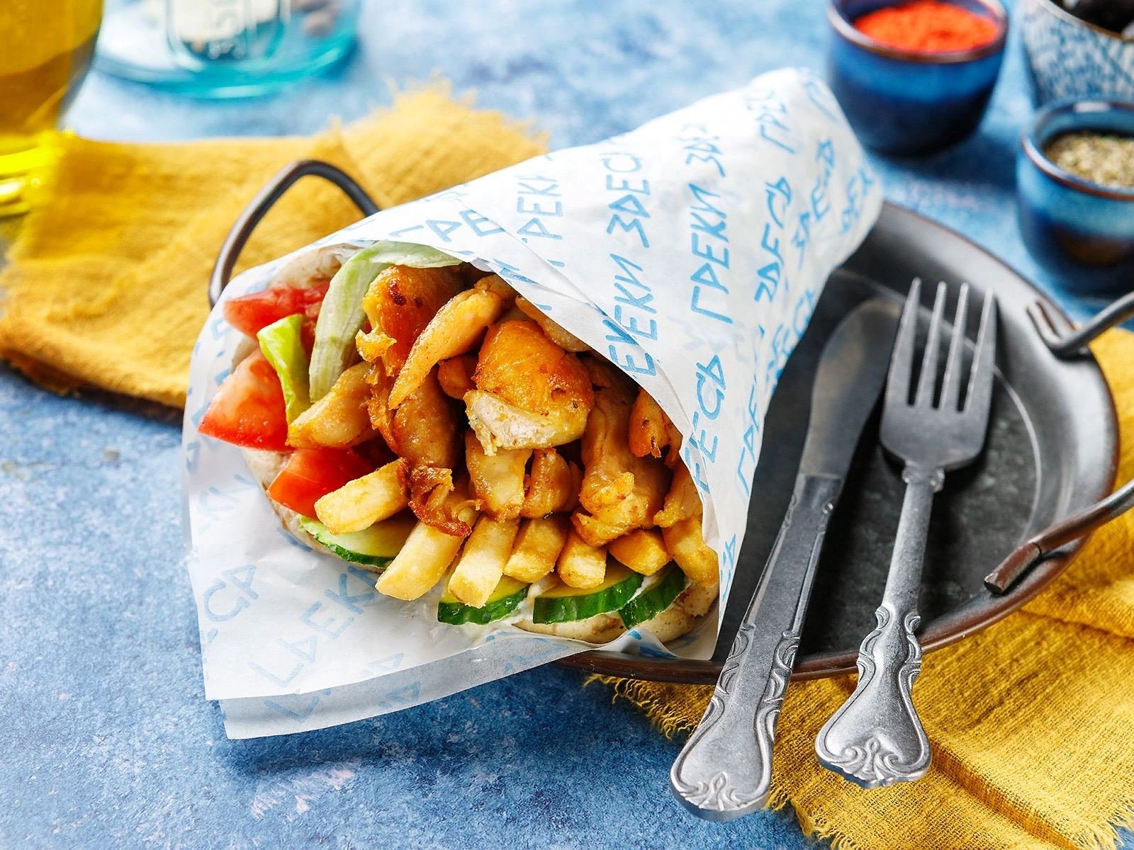 Gyro sandwich in pita with chicken fries and veggies